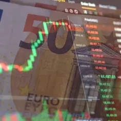 Euro banknoty i wykresy giełdowe – klucz do wiedzy, jak inwestować na giełdzie.